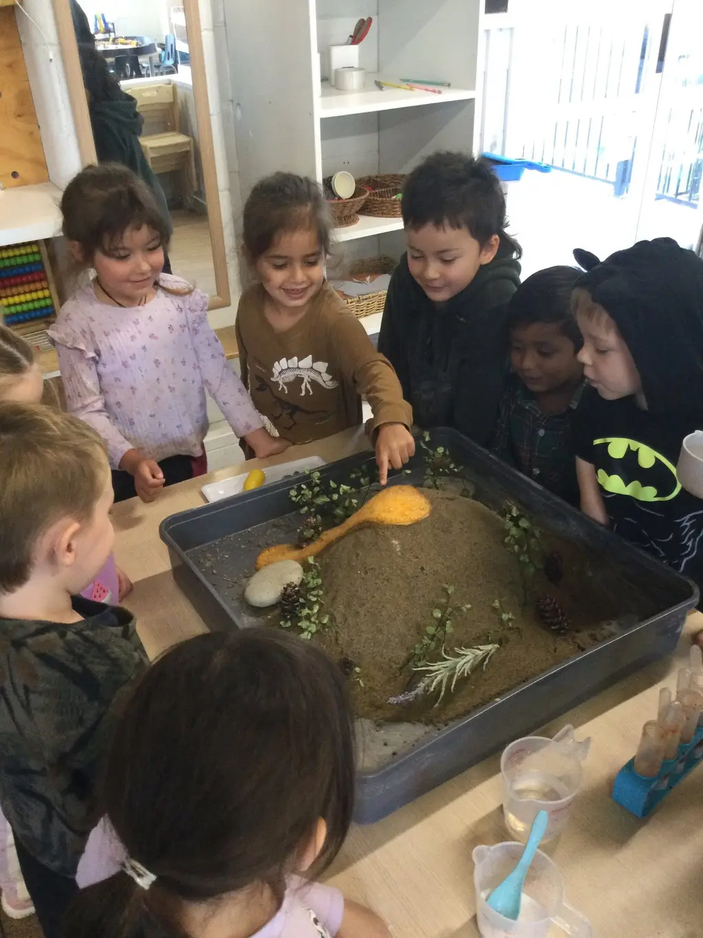 Children exploring outdoors together at Parkside Grove