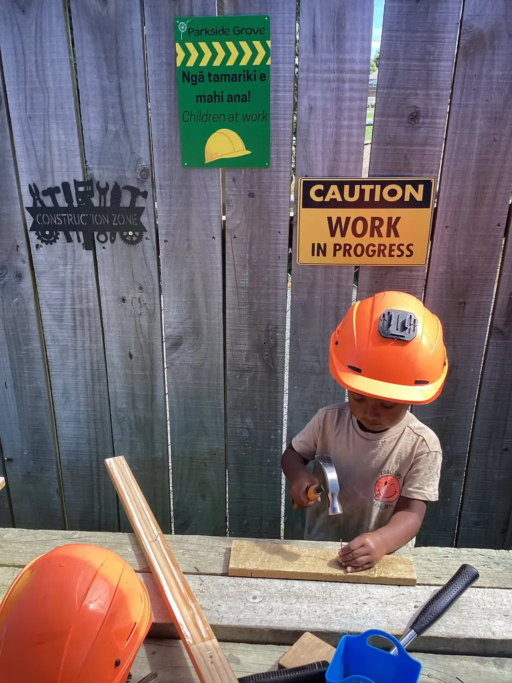 Child exploring construction play at Parkside Grove